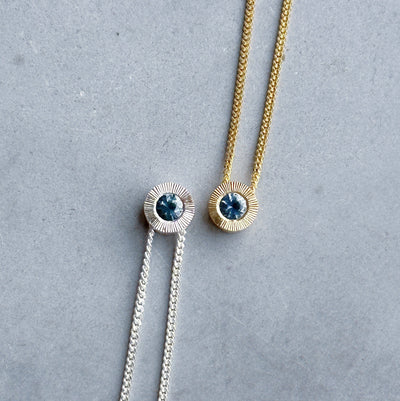 September birthstone Aurora slide necklace with sapphire in silver and yellow gold