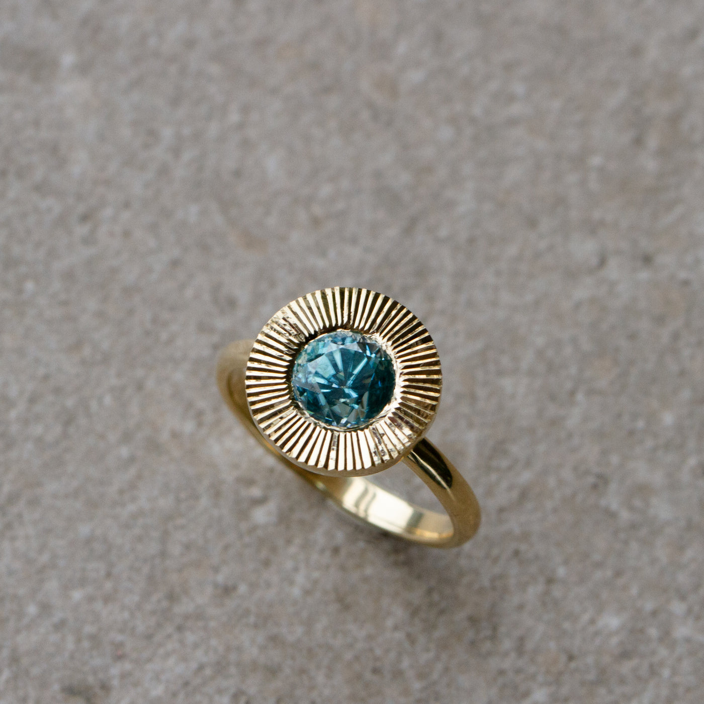 Blue Zircon Aurora Statement Ring on a neutral background, top side angle 