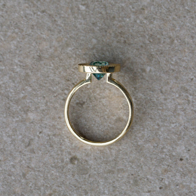Blue Zircon Aurora Statement Ring on a neutral background, side angle 