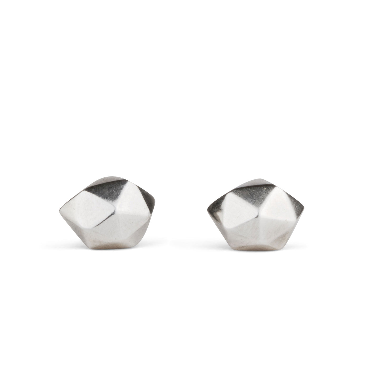 Sterling silver wabi-sabi faceted geometric stud earrings by Corey Egan on a white background