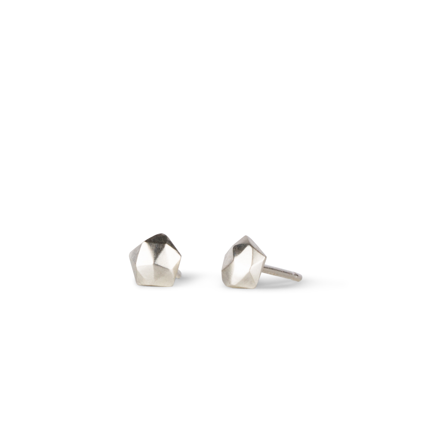 sterling silver micro size geometric faceted stud earrings by Corey Egan on a white background