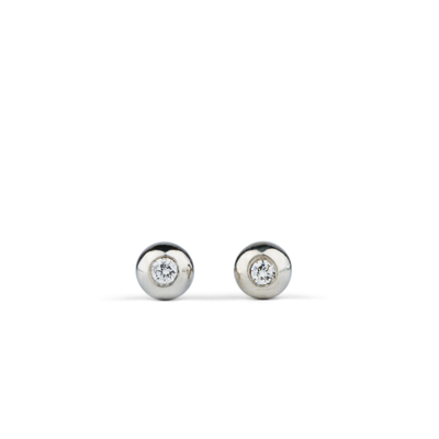 Silver and Diamond Droplet Studs by Corey Egan on a white background