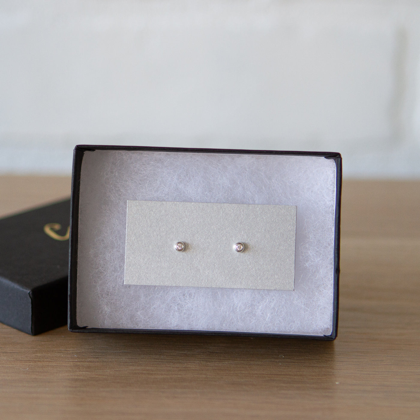Silver and Diamond Droplet Studs by Corey Egan  in a gift box