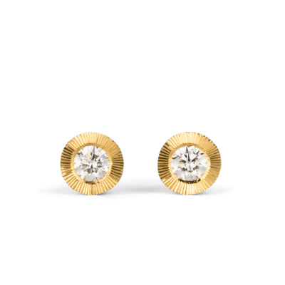 Large Diamond Aurora stud earring in yellow gold with an engraved halo border on a white background