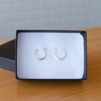  Hoop earrings with hinge closure and herringbone carved texture in sterling silver in a gift box