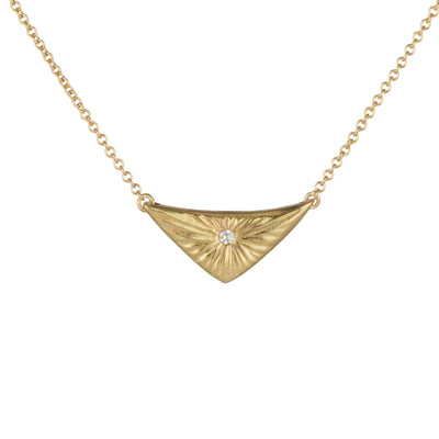 Triangular gold flash necklace with a diamond center and sunburst carved motif in 14k yellow gold. by Corey Egan