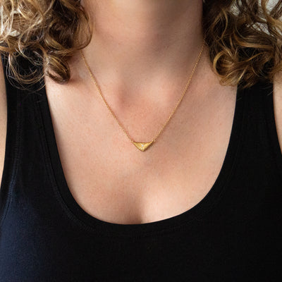 Flash triangular carved sunburst Vermeil Necklace with a diamond center around a neck