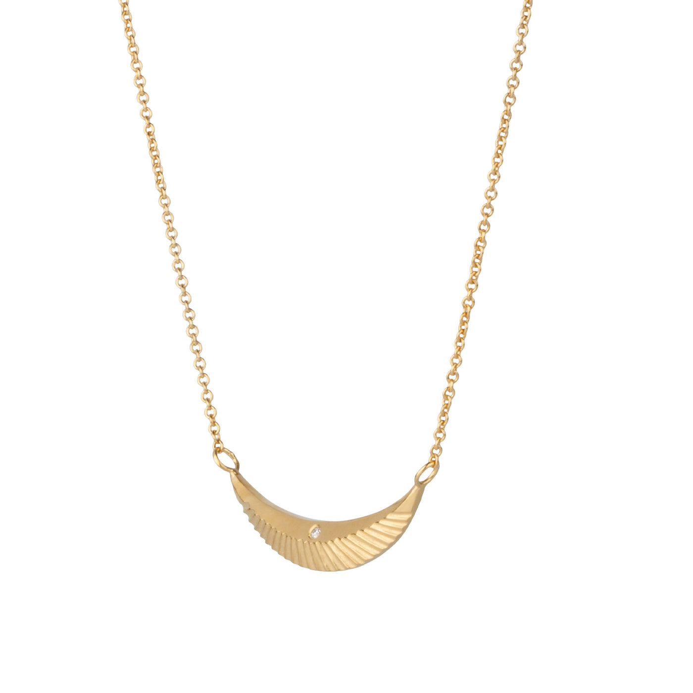 Side view of Crescent necklace with carved rays and a single diamond in vermeil  on a white background