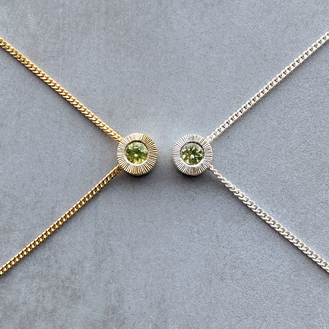 August birthstone Aurora slide necklace with peridot in silver and yellow gold
