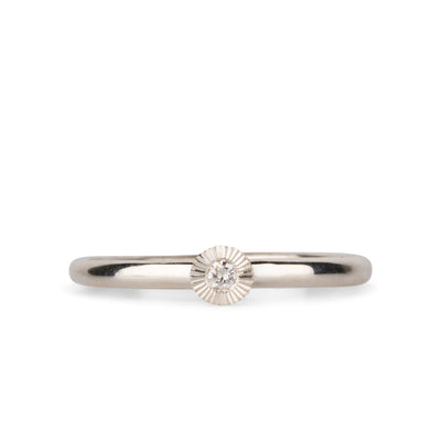 sterling silver small aurora stacking ring with a 2mm center diamond and engraved border