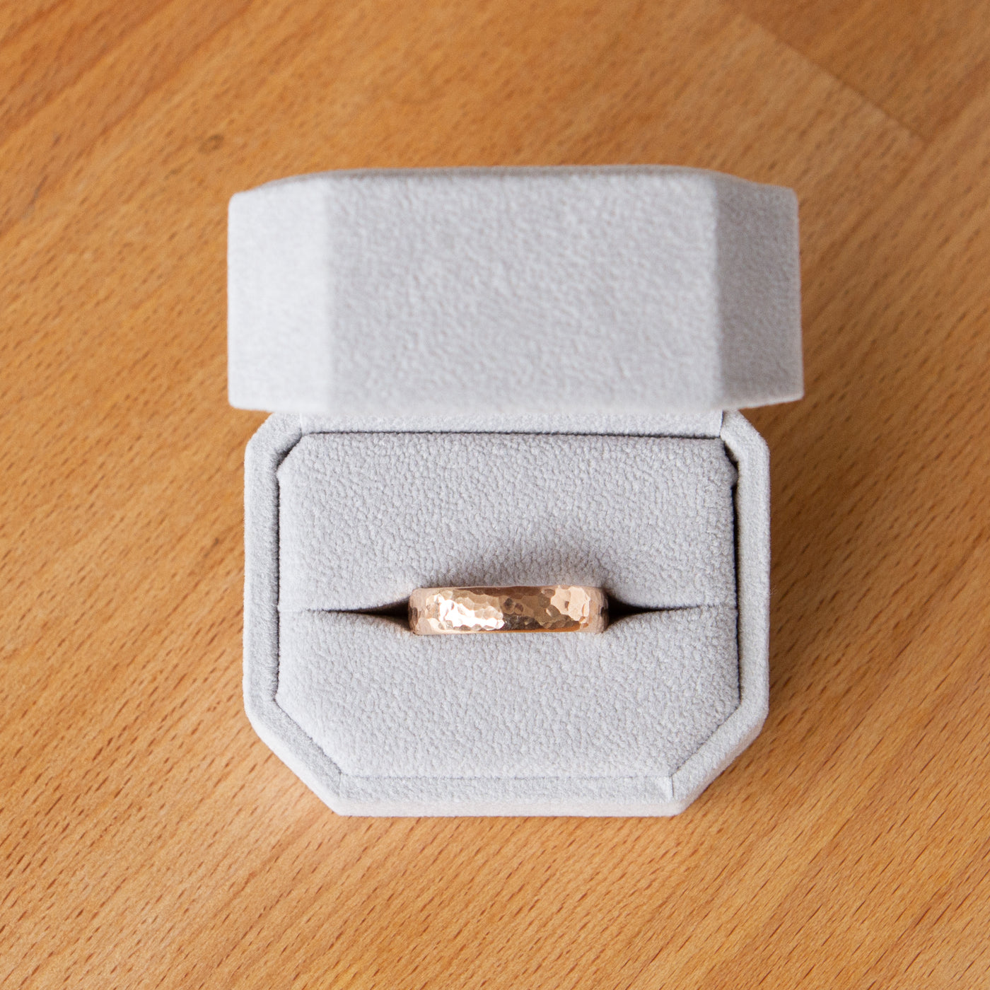 Blue Ridge half round wide rose gold wedding band in a ring box