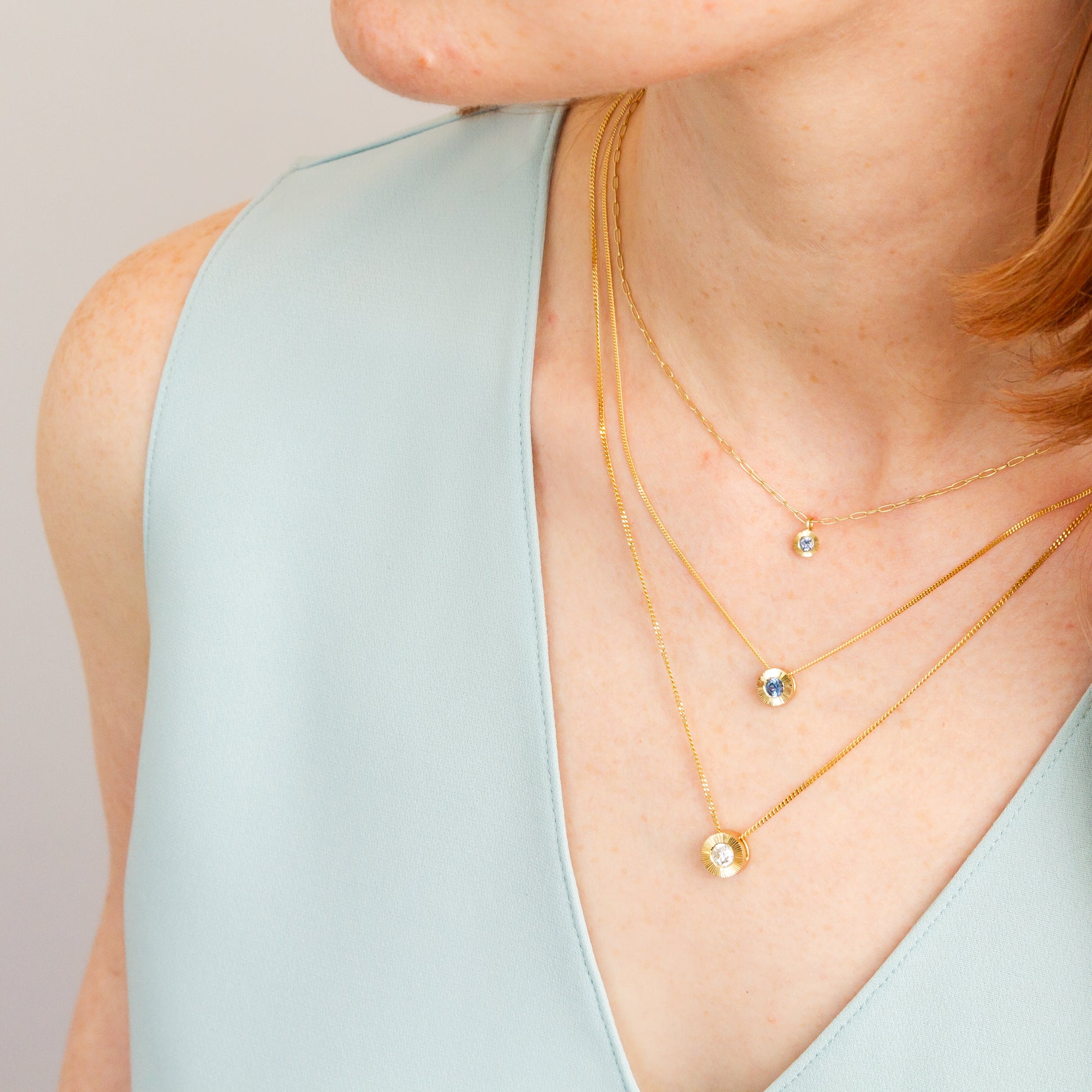 Medium Blue Montana Sapphire Medium Aurora Necklace on a model, styled close up