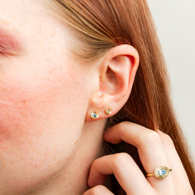 Large Aurora Blue Montana Sapphire Stud Earring in Yellow Gold on a model, close up