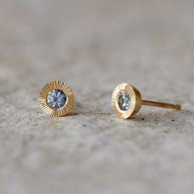 Large Aurora Blue Montana Sapphire Stud Earring in Yellow Gold on a neutral background