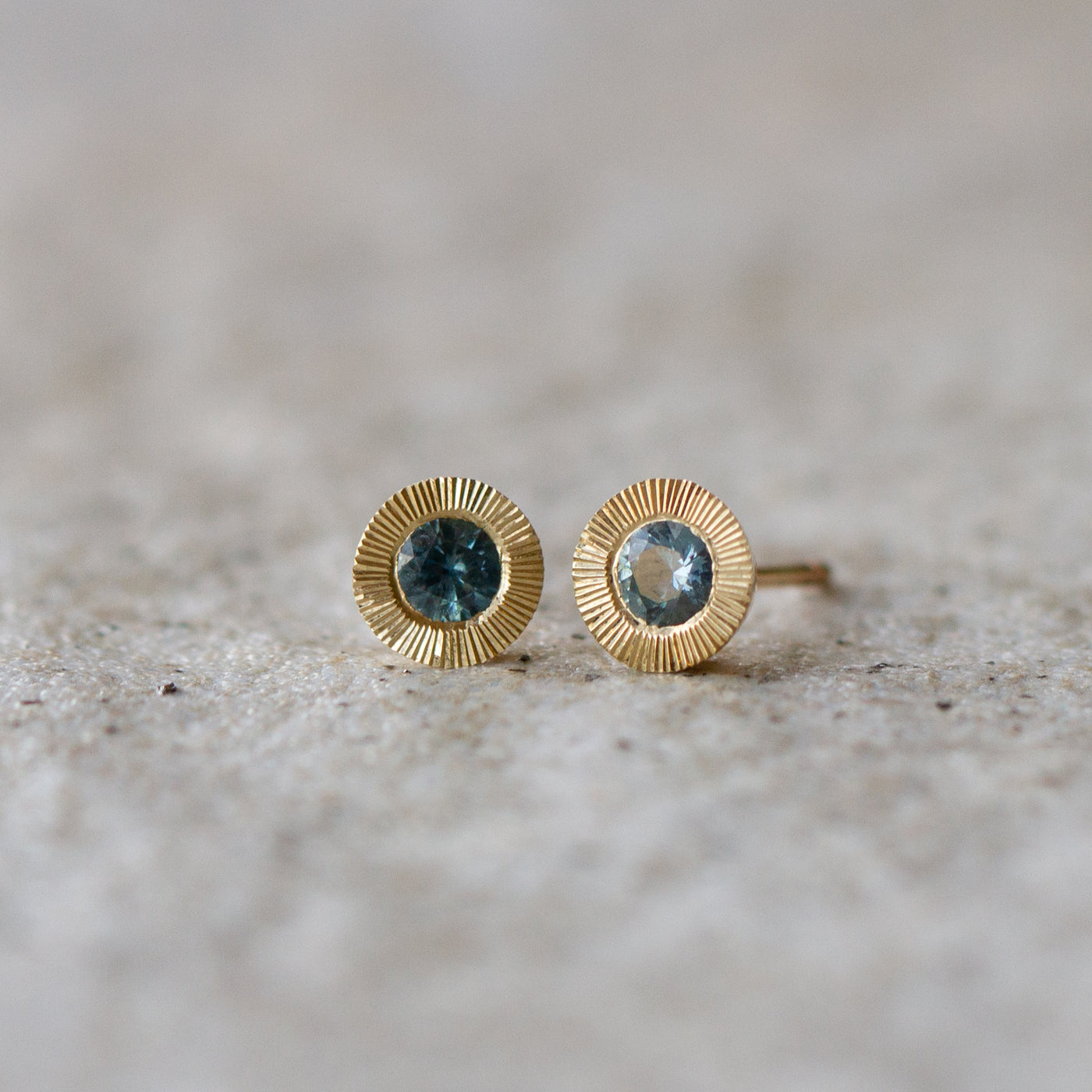 Large Aurora Teal Montana Sapphire Stud Earring in Yellow Gold on a neutral background, front angle