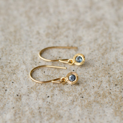 Blue Montana Sapphire Aurora Dangle Earrings in Yellow Gold on a neutral background 1
