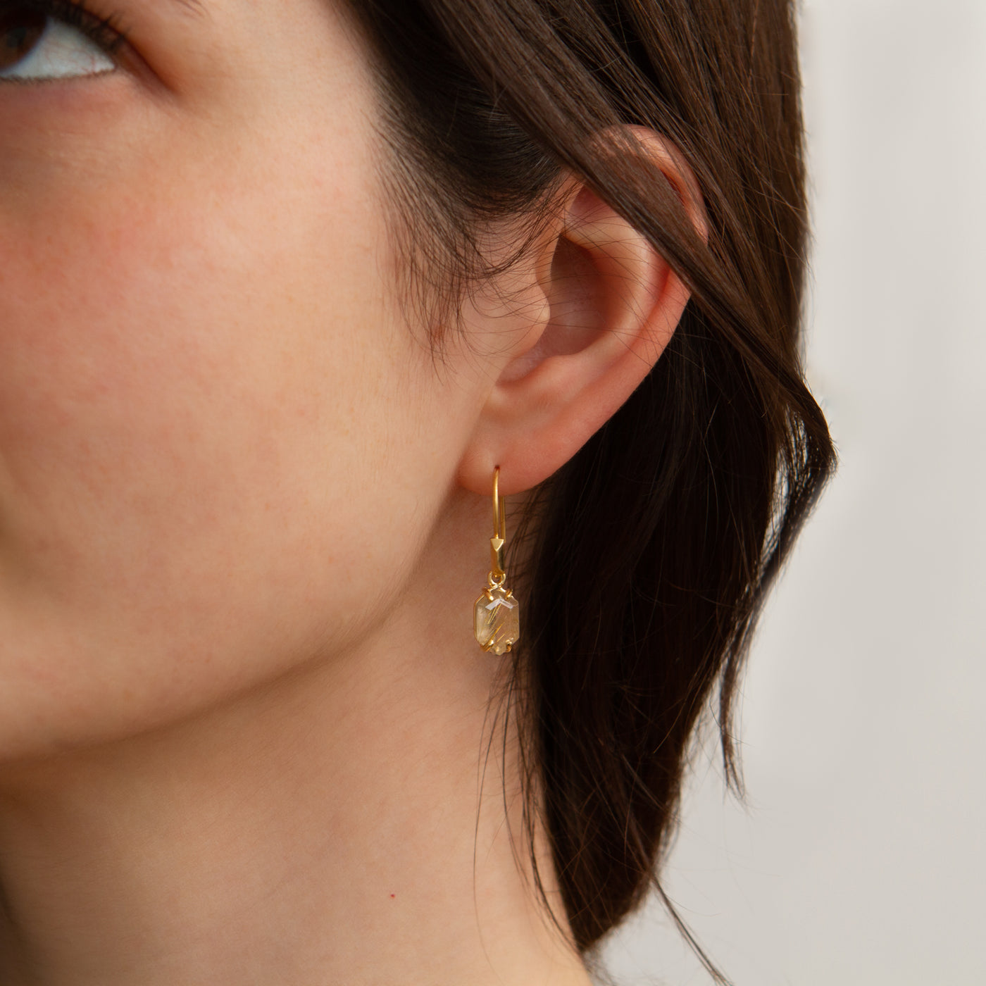 Eloise Rutilated Quartz Earrings in Vermeil modeled on an ear