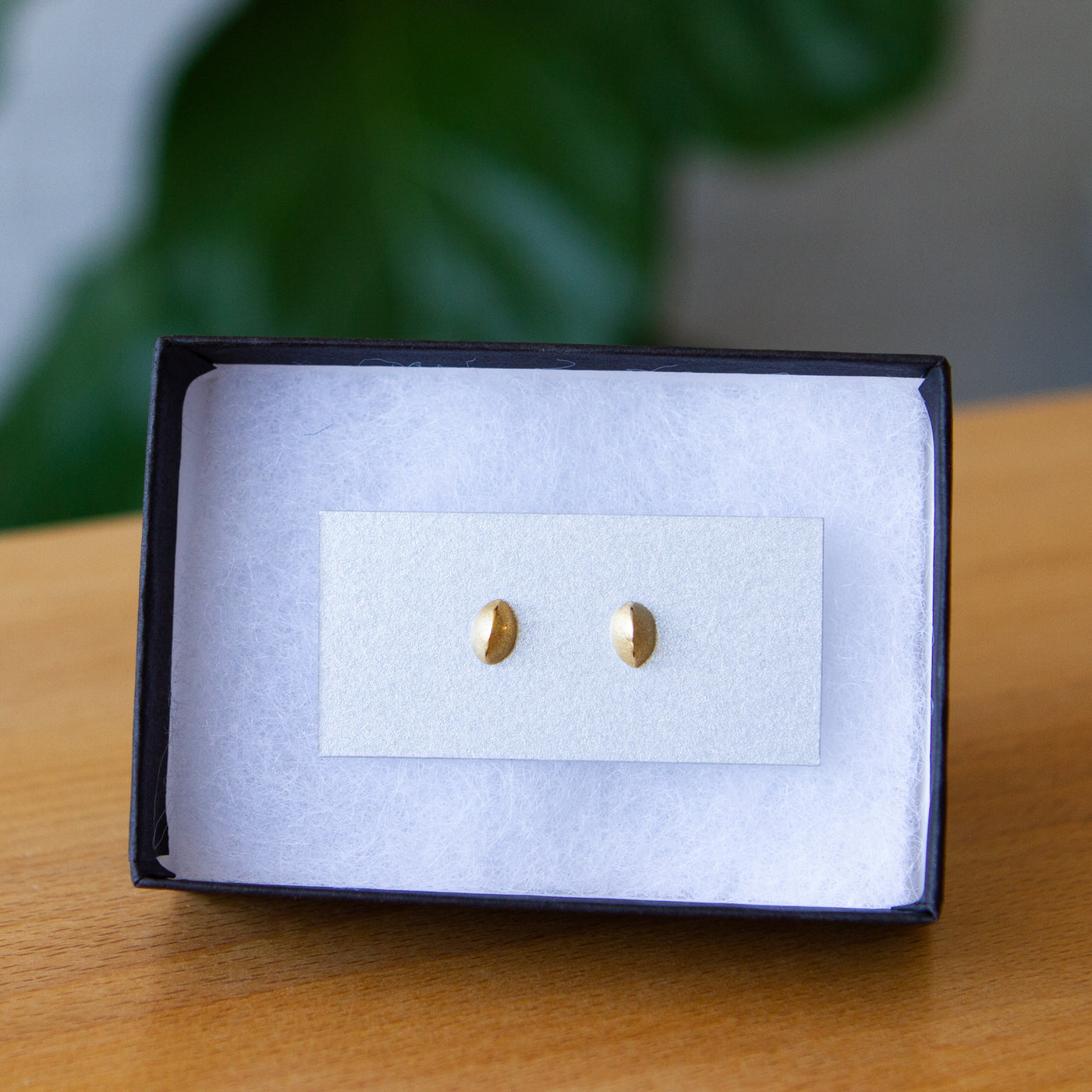 Yellow Gold Dewdrop Studs packaged in a jewelry box