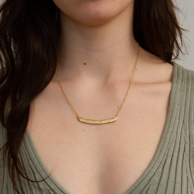 Luminous Bar Vermeil Necklace modeled on a neck, front angle