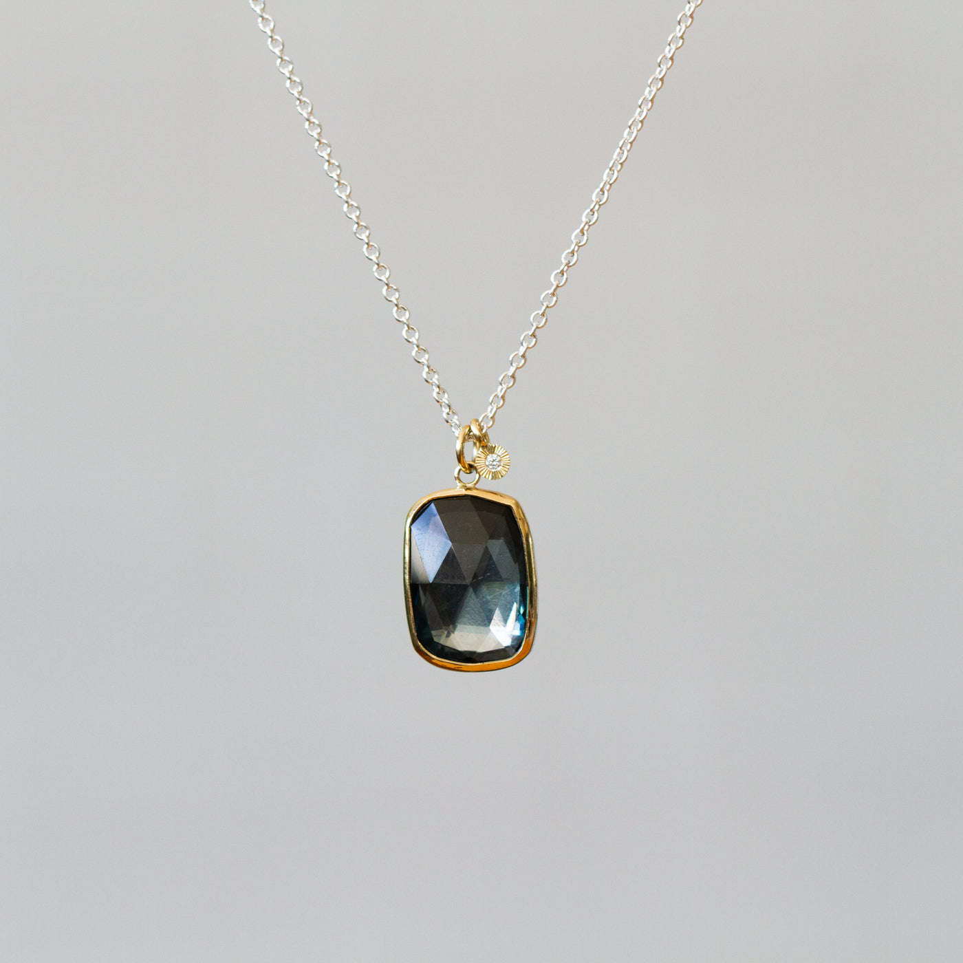 London Blue Topaz Silver and Gold Theia Necklace #8 on a plain background, front angle