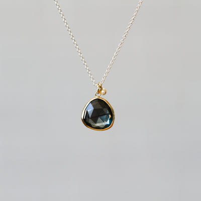 London Blue Topaz Silver and Gold Theia Necklace #9 on a plain background, front angle