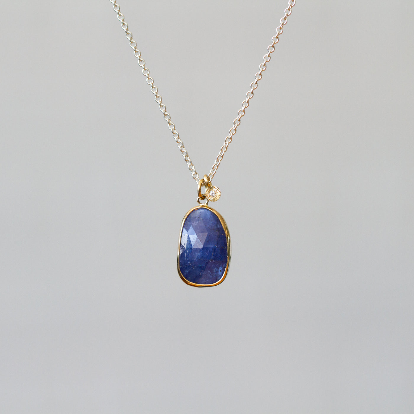 Tanzanite Silver and Gold Theia Necklace on a plain background, front angle