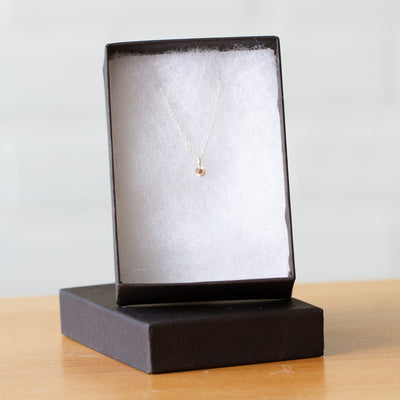 Orange Sapphire Rise Necklace in Sterling Silver packaged in a jewelry box