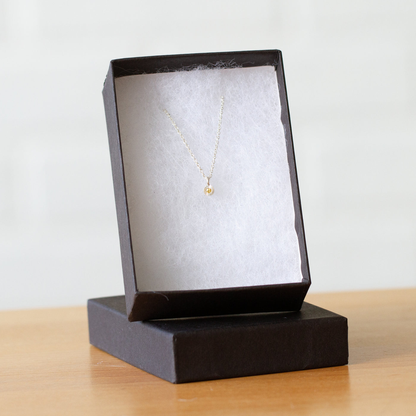 Yellow Sapphire Rise Necklace in Sterling Silver packaged in a jewelry box