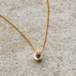 Medium Blue Montana Sapphire Medium Aurora Necklace on a neutral background