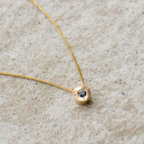 Medium Blue Montana Sapphire Medium Aurora Necklace on a neutral background, left side