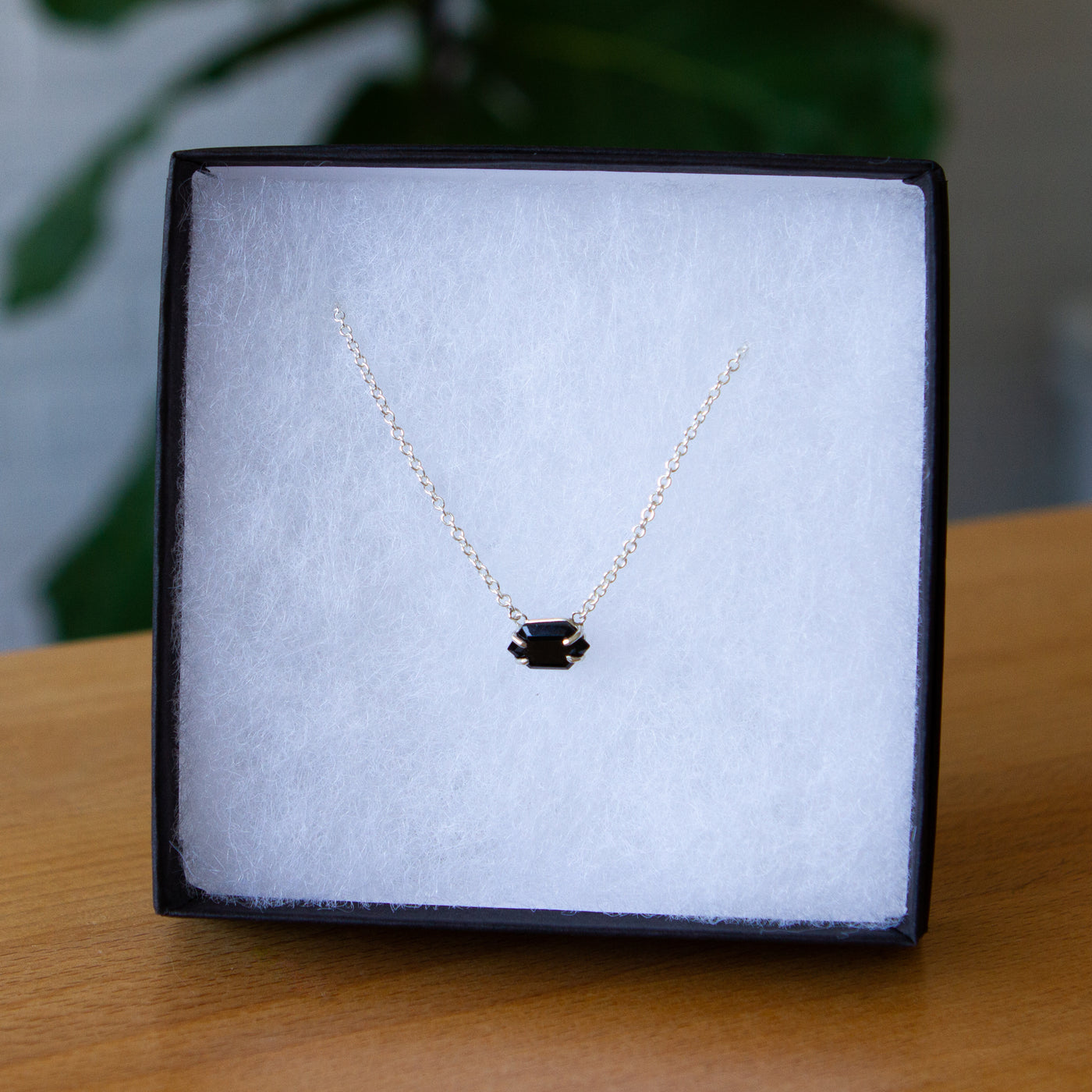 Emerson Black Garnet Necklace in Silver packaged in a jewelry box