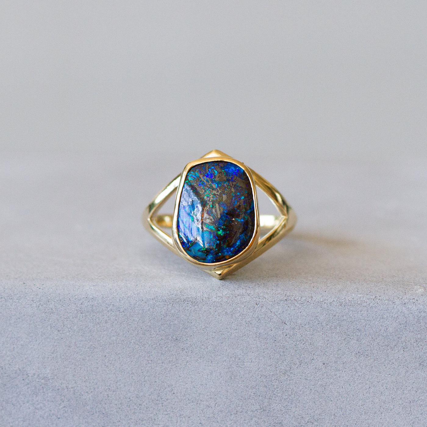 Australian Boulder Opal Gold Cleo Ring #2 on a plain background, front angle