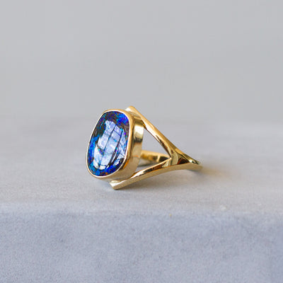 Australian Boulder Opal Gold Cleo Ring #2 on a plain background, side angle