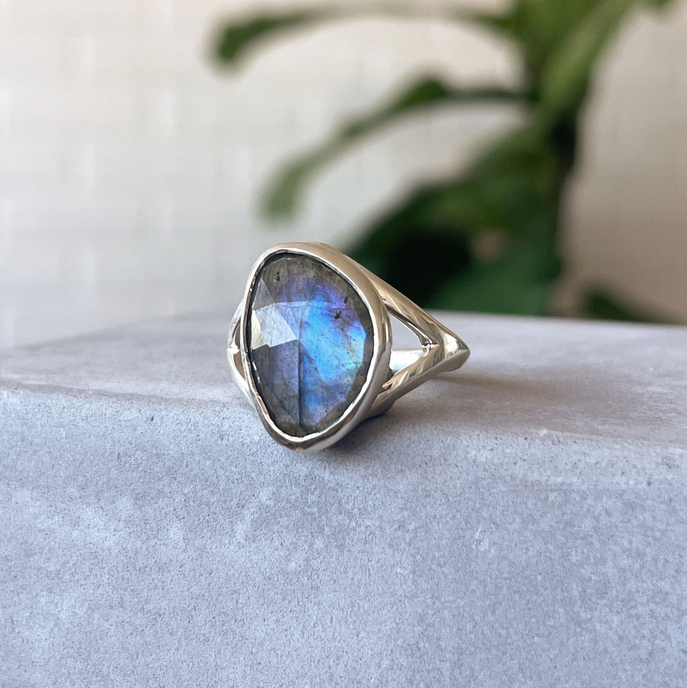 Labradorite Cleo Ring in Sterling Silver #3 on a concrete table, side angle