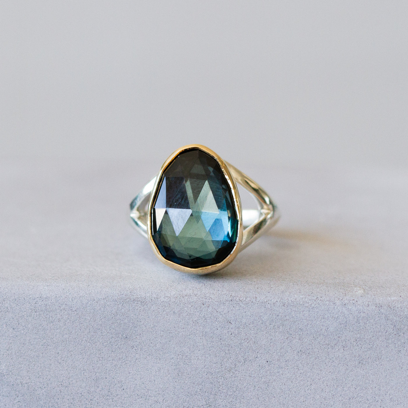 London Blue Topaz Silver and Gold Cleo Ring #7 in front of a plain background, front angle