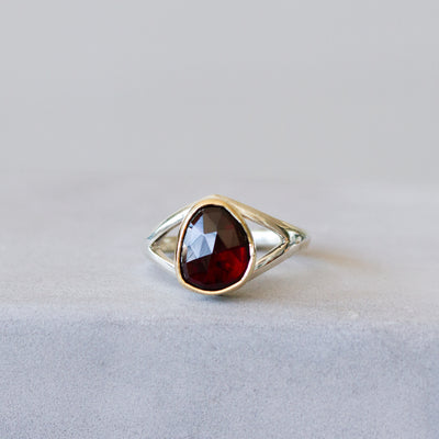 Red Tourmaline Silver and Gold Cleo Ring on a plain background, front angle