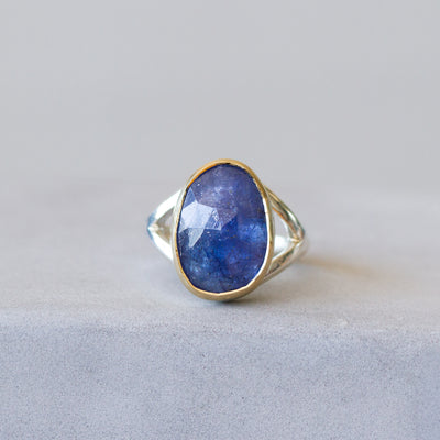 Tanzanite Silver and Gold Cleo Ring on a plain background, front angle