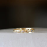 Gold Pebble Droplet Eternity Band