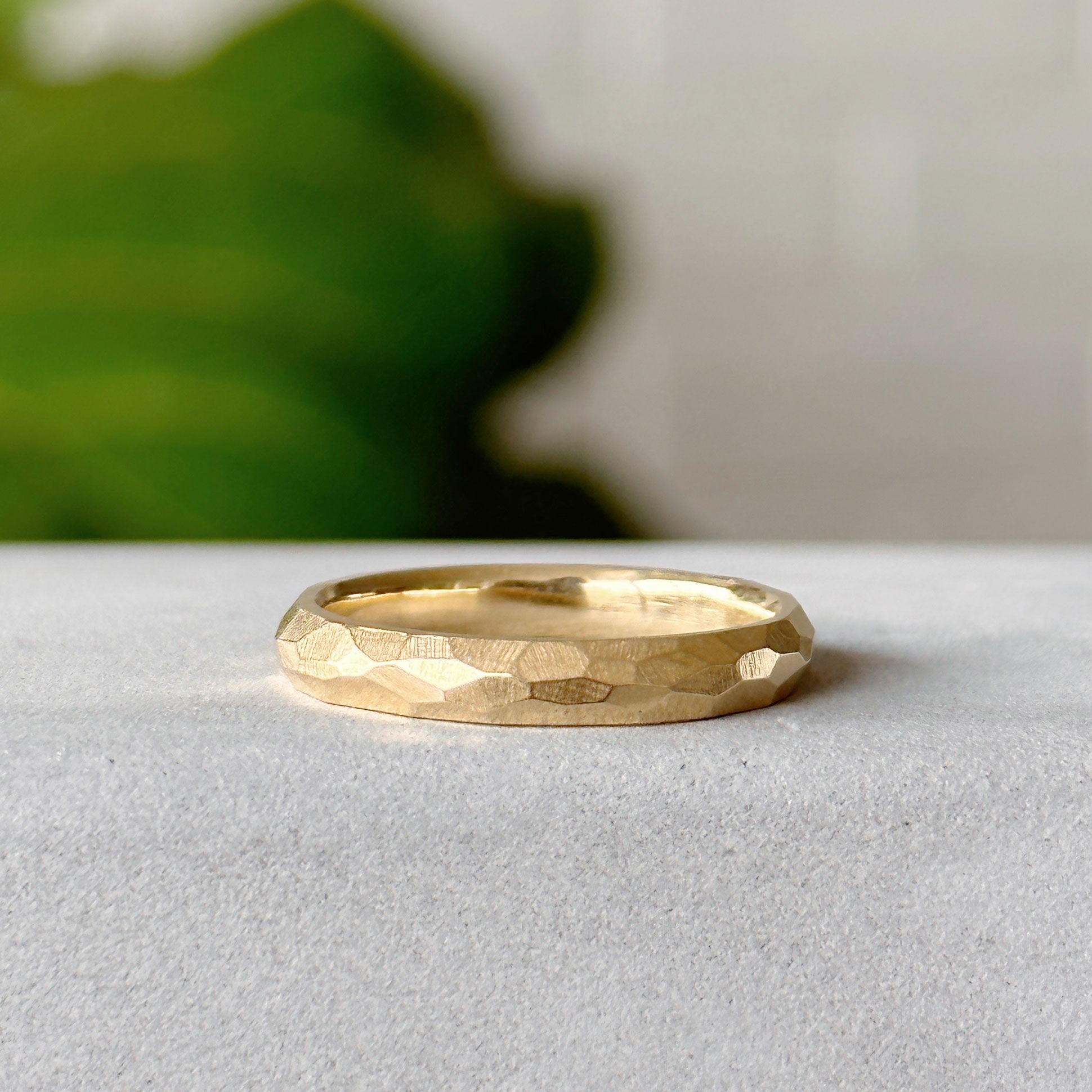 Denali Band in gold on neutral gray background