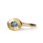 East-West Aurora Solitaire with Teal Oval Montana Sapphire on a white background, side angle