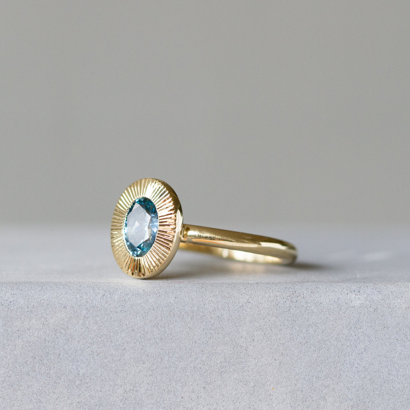 North-South Oval Aurora Ring with Green-Blue Montana Sapphire