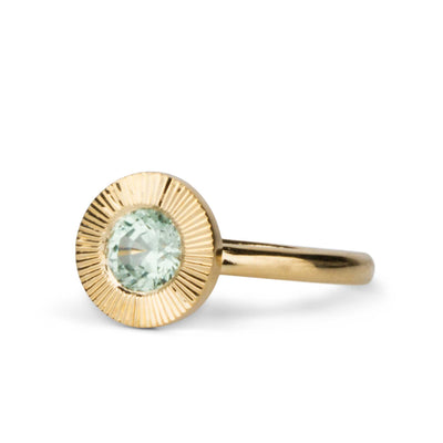 Green Montana Sapphire Aurora Solitaire .95ct on a white background, side angle