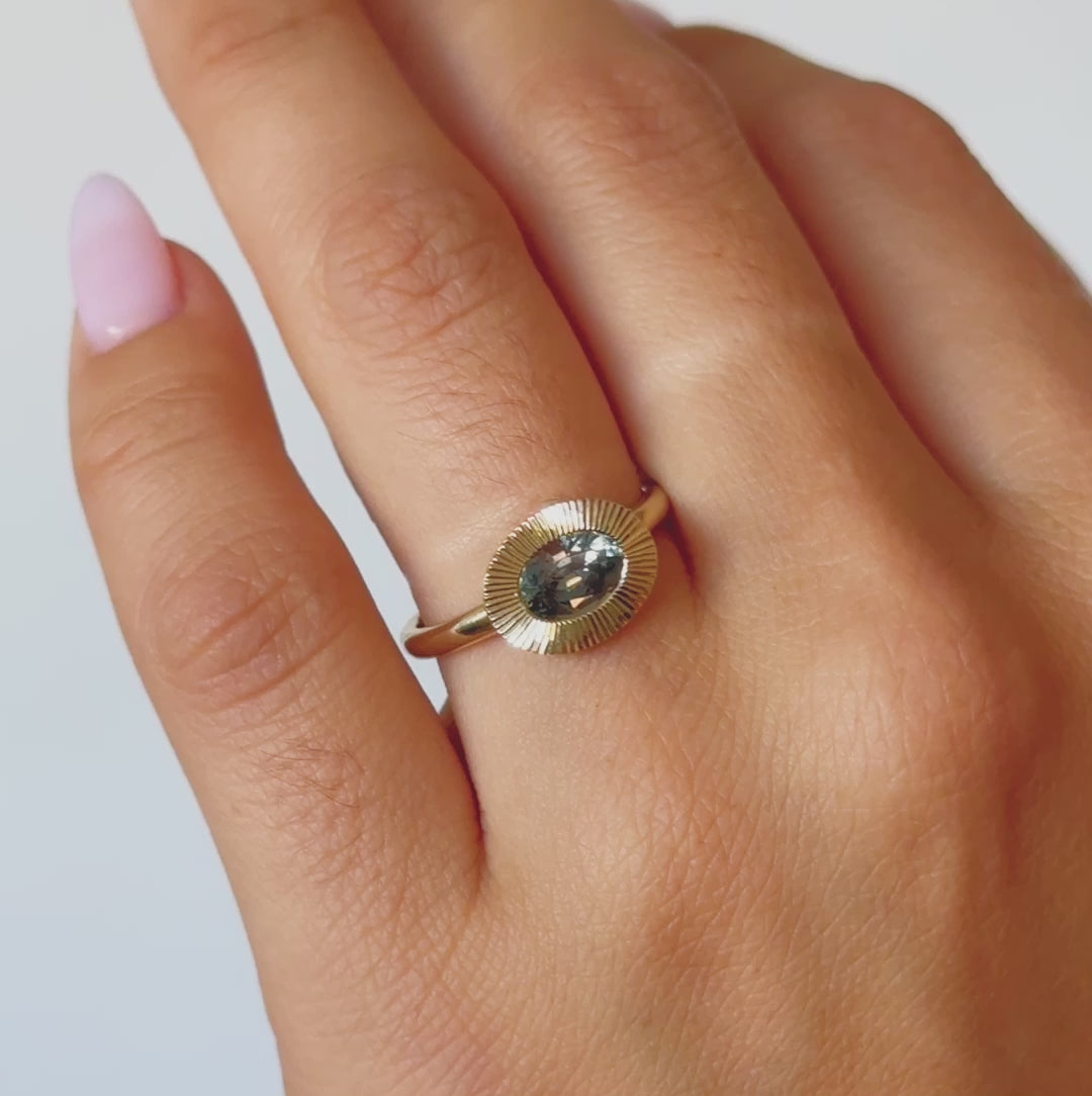 Video of East-West Aurora Solitaire with Blue-Green Montana Sapphire on a model