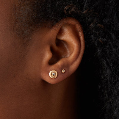 Yellow Gold Diamond Droplet Studs on an ear by Corey Egan