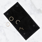 Corey Egan Logo Jewelry Pouch with rings peeking out