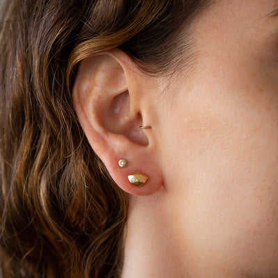 Tiny Fragment Diamond Studs in Vermeil on an ear | Corey Egan