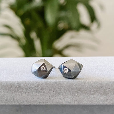 Oxidized Silver Faceted Stud earrings with Diamonds in natural light