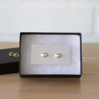 Sterling silver wabi-sabi faceted geometric stud earrings by Corey Egan in a gift box
