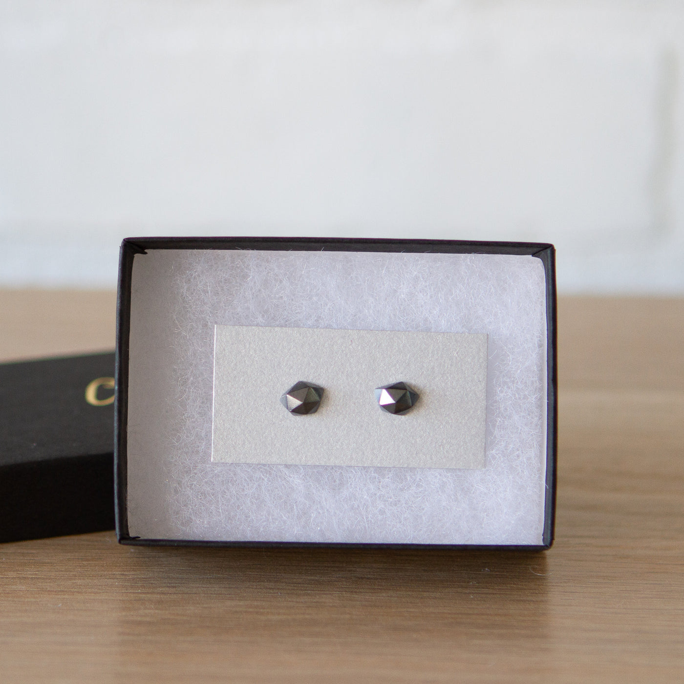 oxidized silver faceted tiny fragment stud earrings in a gift box