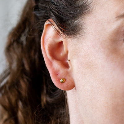 Vermeil Micro Fragment Diamond Stud Earrings by Corey Egan on an ear